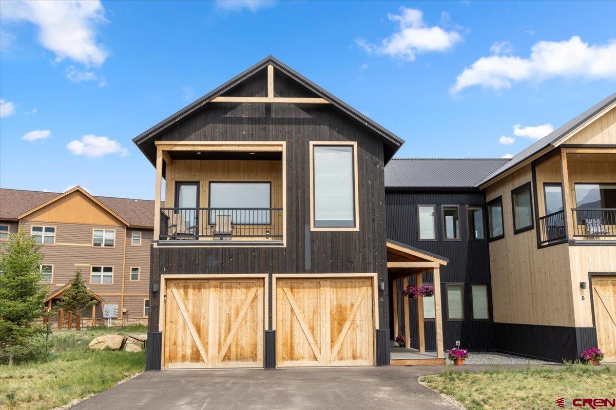 101 Elk Valley Road, Unit A Crested Butte, CO 81224 - Photo 42 of 42 a front view of a house with a yard