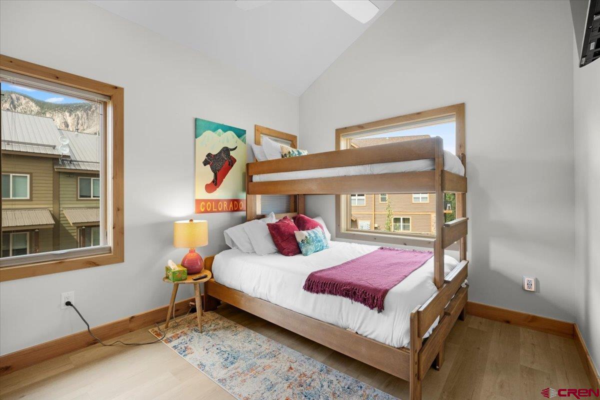 101 Elk Valley Road, Unit A Crested Butte, CO 81224 - Photo 5 of 42 a bedroom with a bed and window