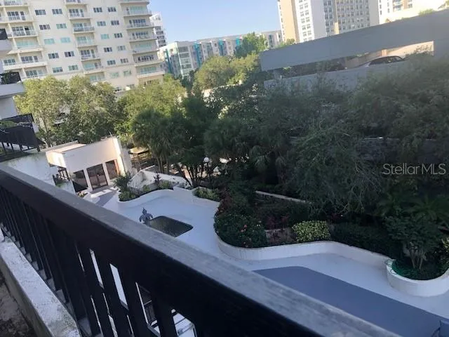 a view of a house with backyard sitting area and garden