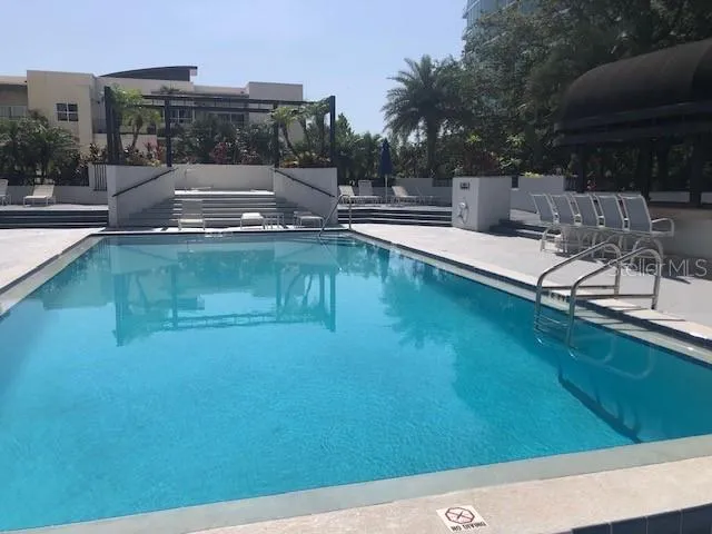 a view of a swimming pool with a patio