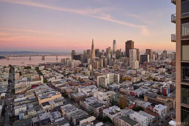 a living room with furniture window and wooden floor