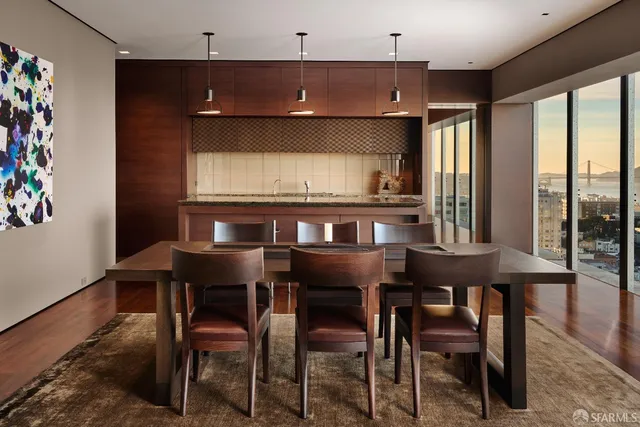 a kitchen with a sink a counter space appliances and cabinets