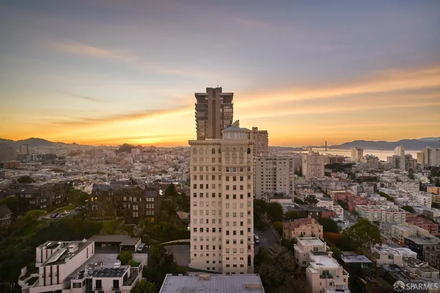 a view of living room with furniture and floor to ceiling window