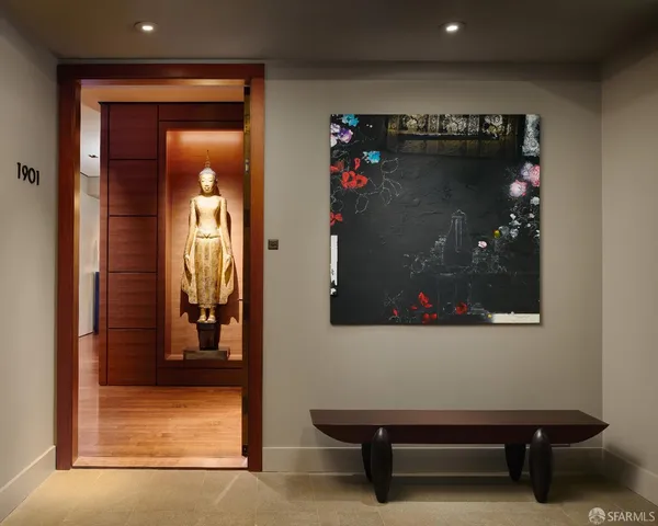 a view of a hallway with wooden floor and windows