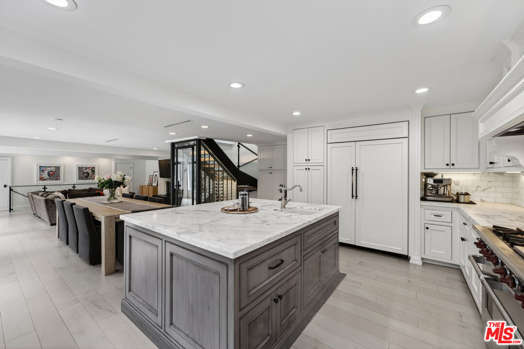 760 South San Rafael Avenue Pasadena, CA 91105 - Photo 12 of 45 a kitchen with a stove a refrigerator and a sink