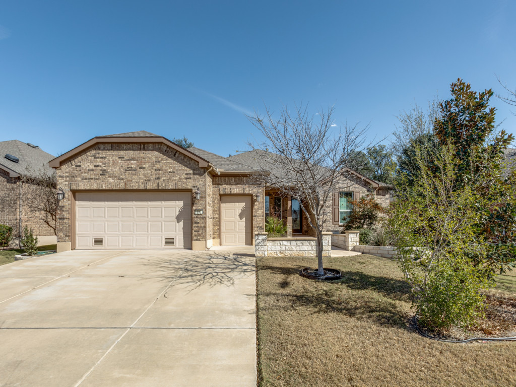 205 Cypress Springs Way Georgetown, TX 78633 - Photo 1 of 1 Ranch-style home with brick siding, driveway, an attached garage, and a shingled roof