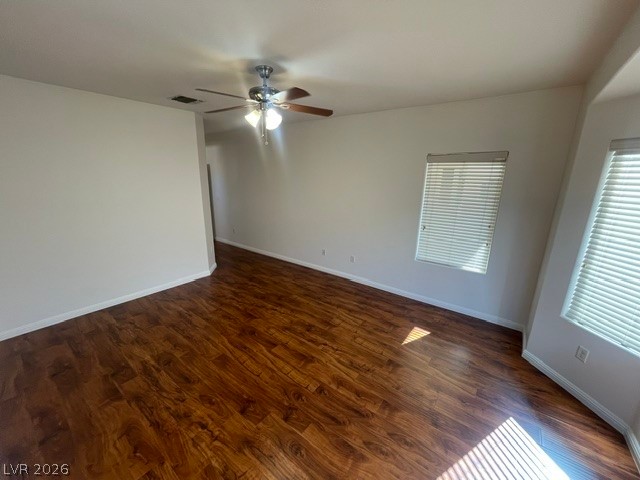 3047 Hickory Valley Road Henderson, NV 89052 - Photo 14 of 21 Rich hardwood-style flooring extends throughout this generous, open living space, offering warmth and continuity.
