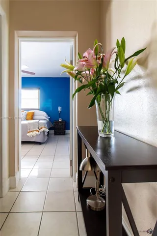 a view of living room with furniture and flower pot