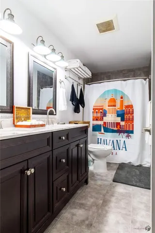 a bathroom with a sink a mirror and a bathtub