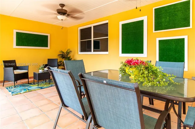 a view of a dining room with furniture and a window