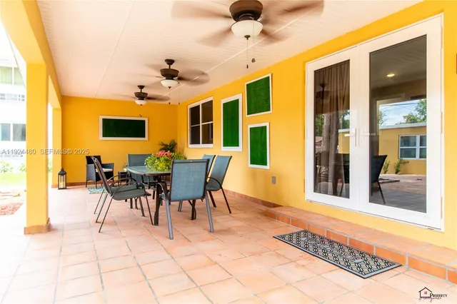 a view of a livingroom with furniture and a window