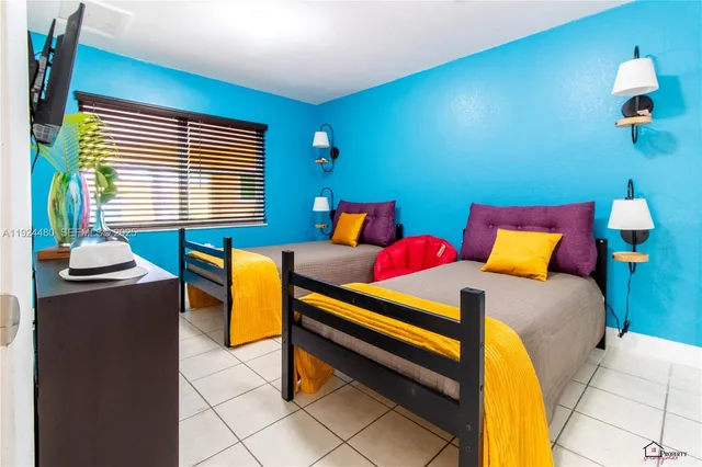 a bedroom with a bed and a table