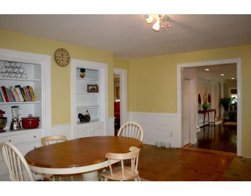 156 Boston Post Road Wayland, MA 01778 - Photo 12 of 20 a living room with a table and chairs