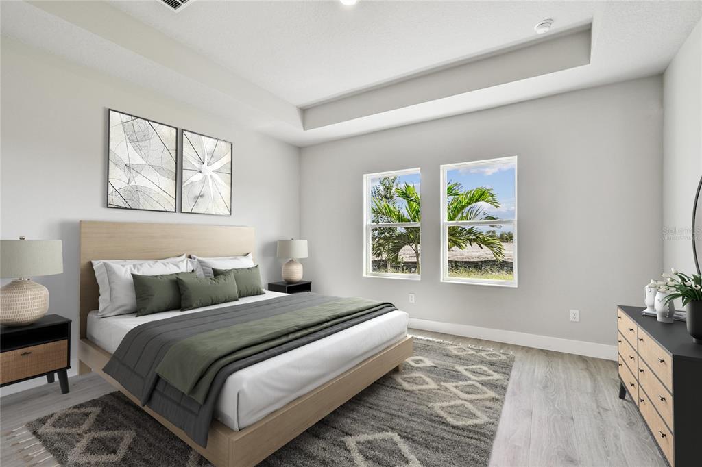 11743 Full Moon Loop Parrish, FL 34219 - Photo 17 of 42 a bedroom with a bed and a window