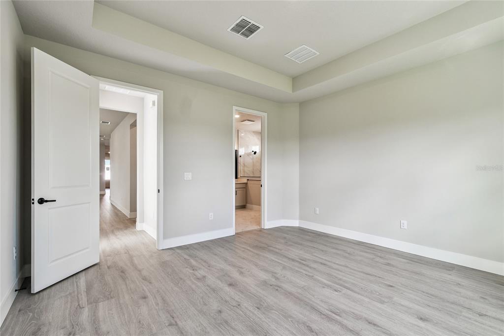 11743 Full Moon Loop Parrish, FL 34219 - Photo 18 of 42 wooden floor in an empty room