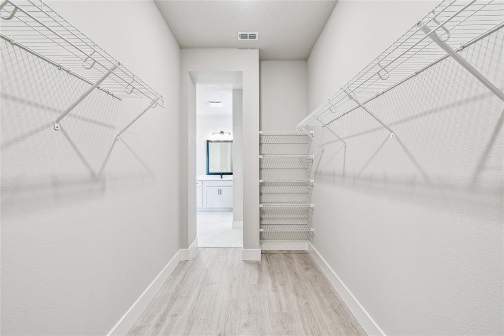 11743 Full Moon Loop Parrish, FL 34219 - Photo 25 of 42 wooden floor in an empty room