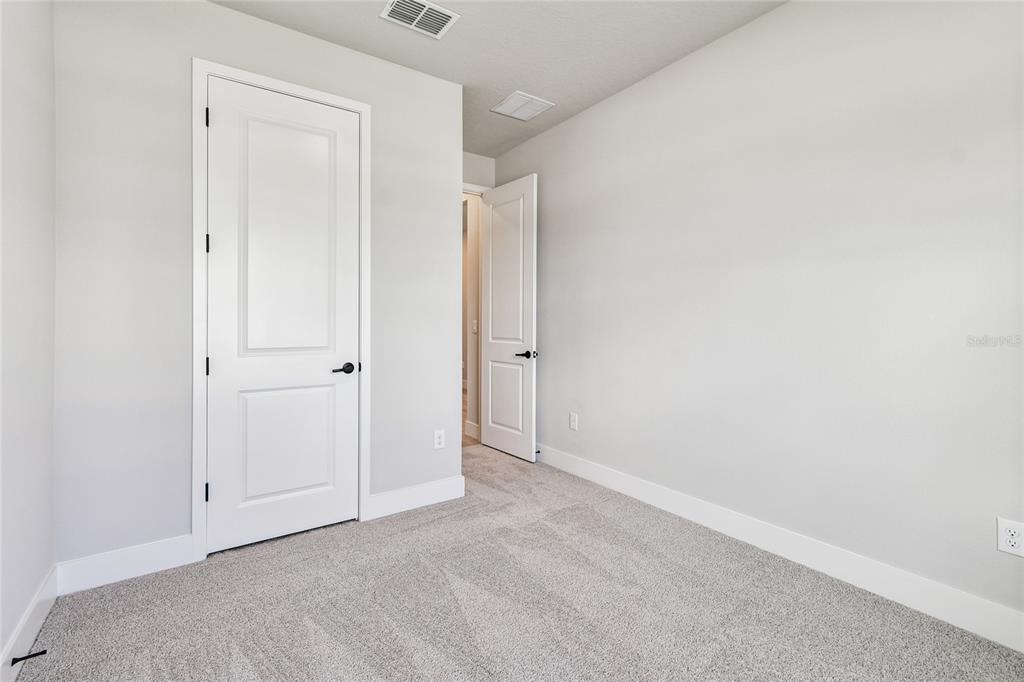 11743 Full Moon Loop Parrish, FL 34219 - Photo 27 of 42 a view of an empty room