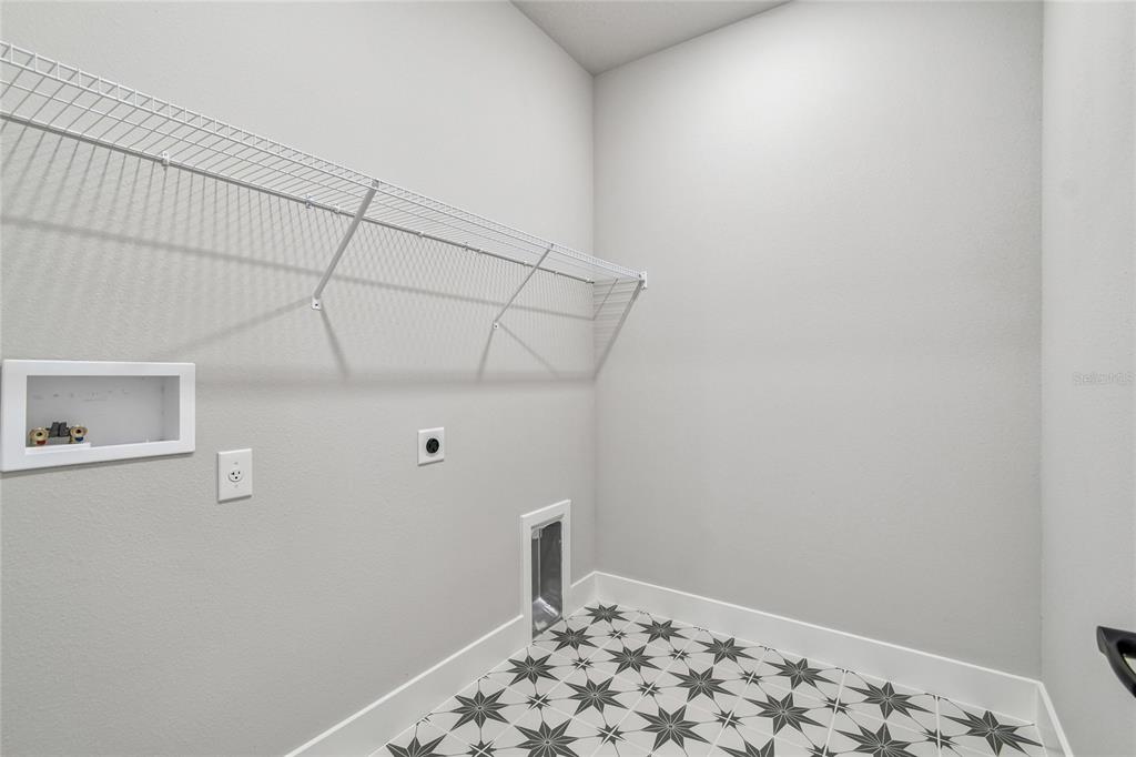 11743 Full Moon Loop Parrish, FL 34219 - Photo 36 of 42 a bathroom with a sink and a window