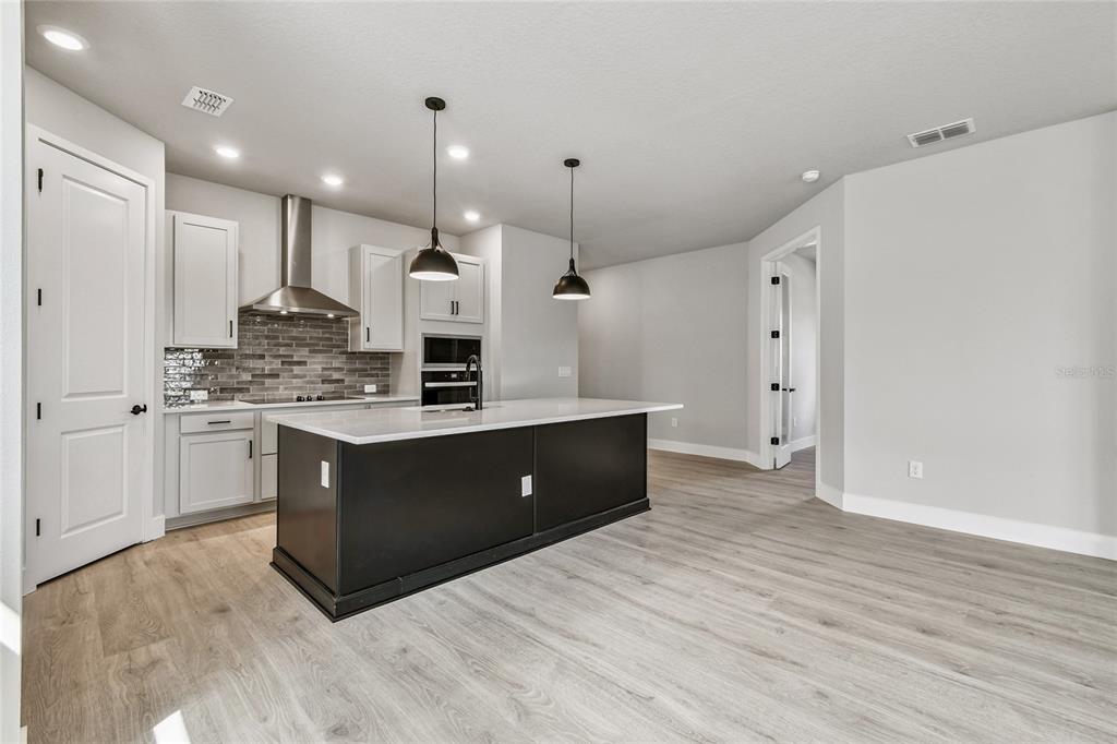 11743 Full Moon Loop Parrish, FL 34219 - Photo 8 of 42 a large bathroom with a sink double vanity and a shower