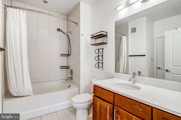 a bathroom with a sink a toilet and a bathtub