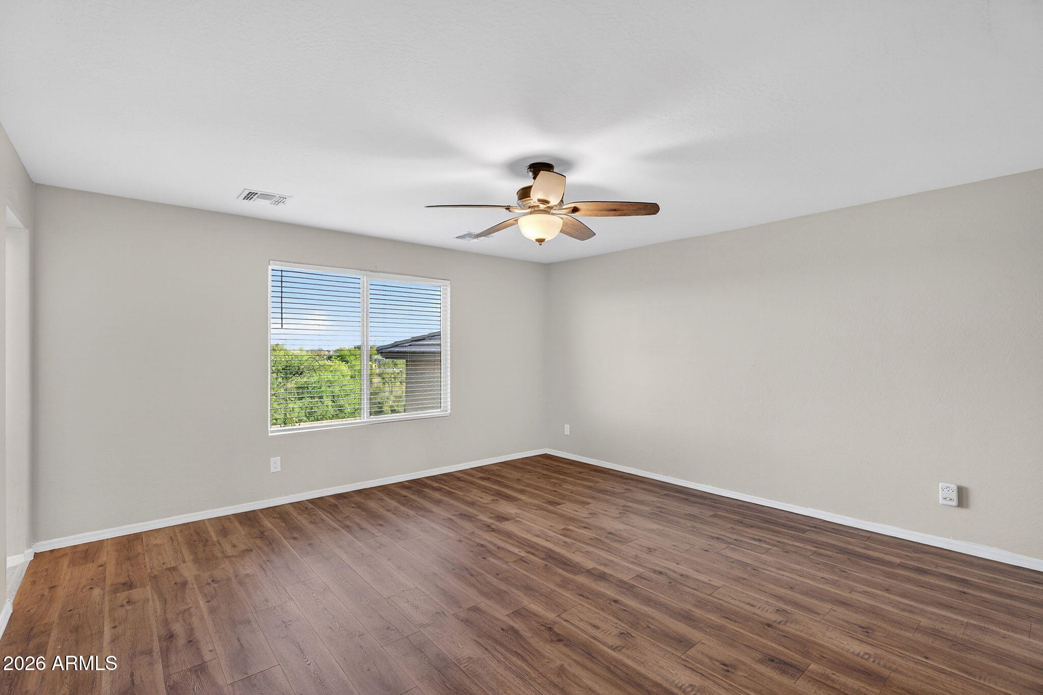10061 Cotton Road Florence, AZ 85132 - Photo 23 of 53 wooden floor in an empty room with a window
