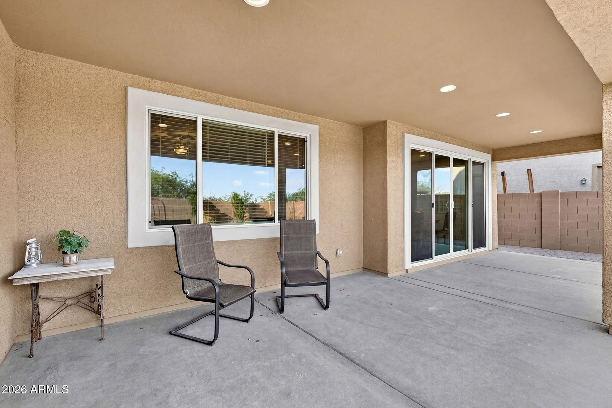 10061 Cotton Road Florence, AZ 85132 - Photo 44 of 53 a living room with furniture and a floor to ceiling window