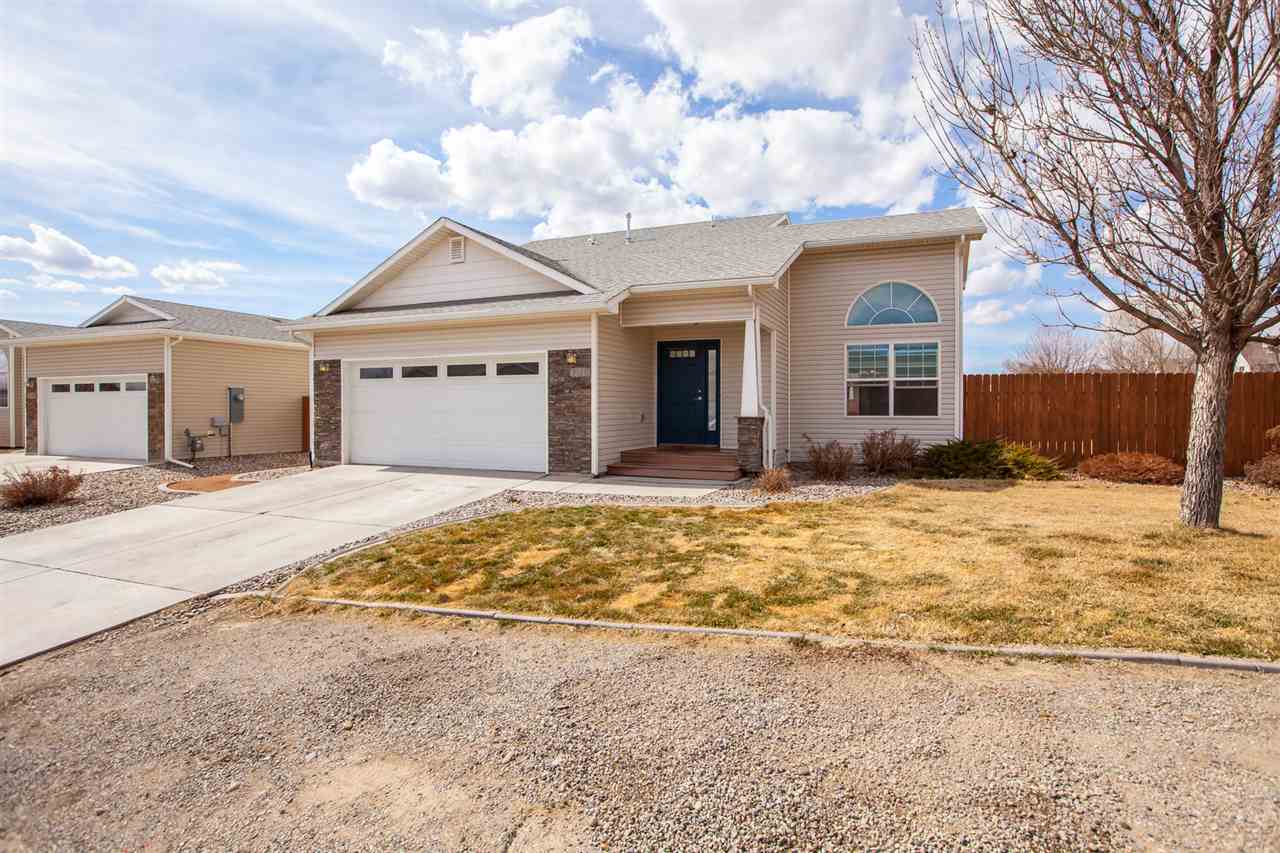 3138 Dublin Way Grand Junction, CO 81504 - Photo 1 of 42 a view of the house with snow on the road