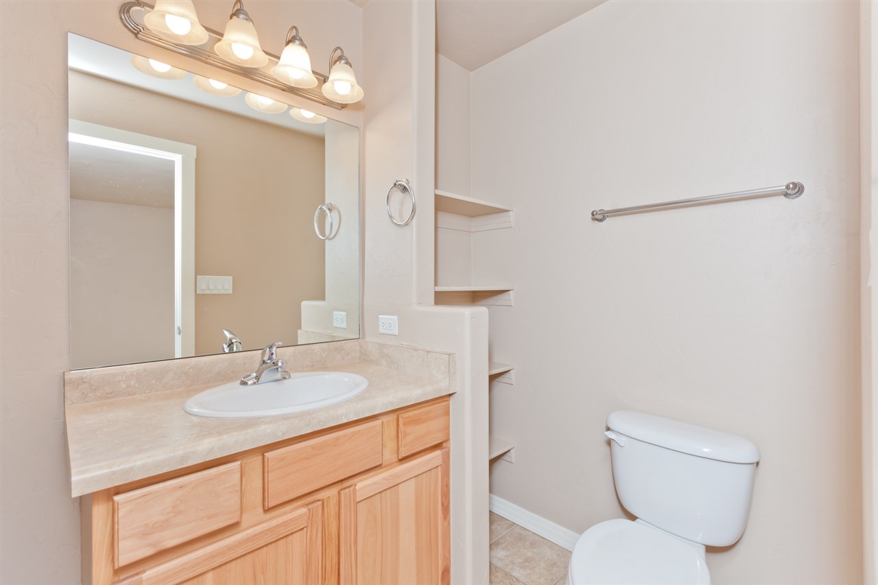 3138 Dublin Way Grand Junction, CO 81504 - Photo 21 of 42 a bathroom with a sink vanity mirror and toilet