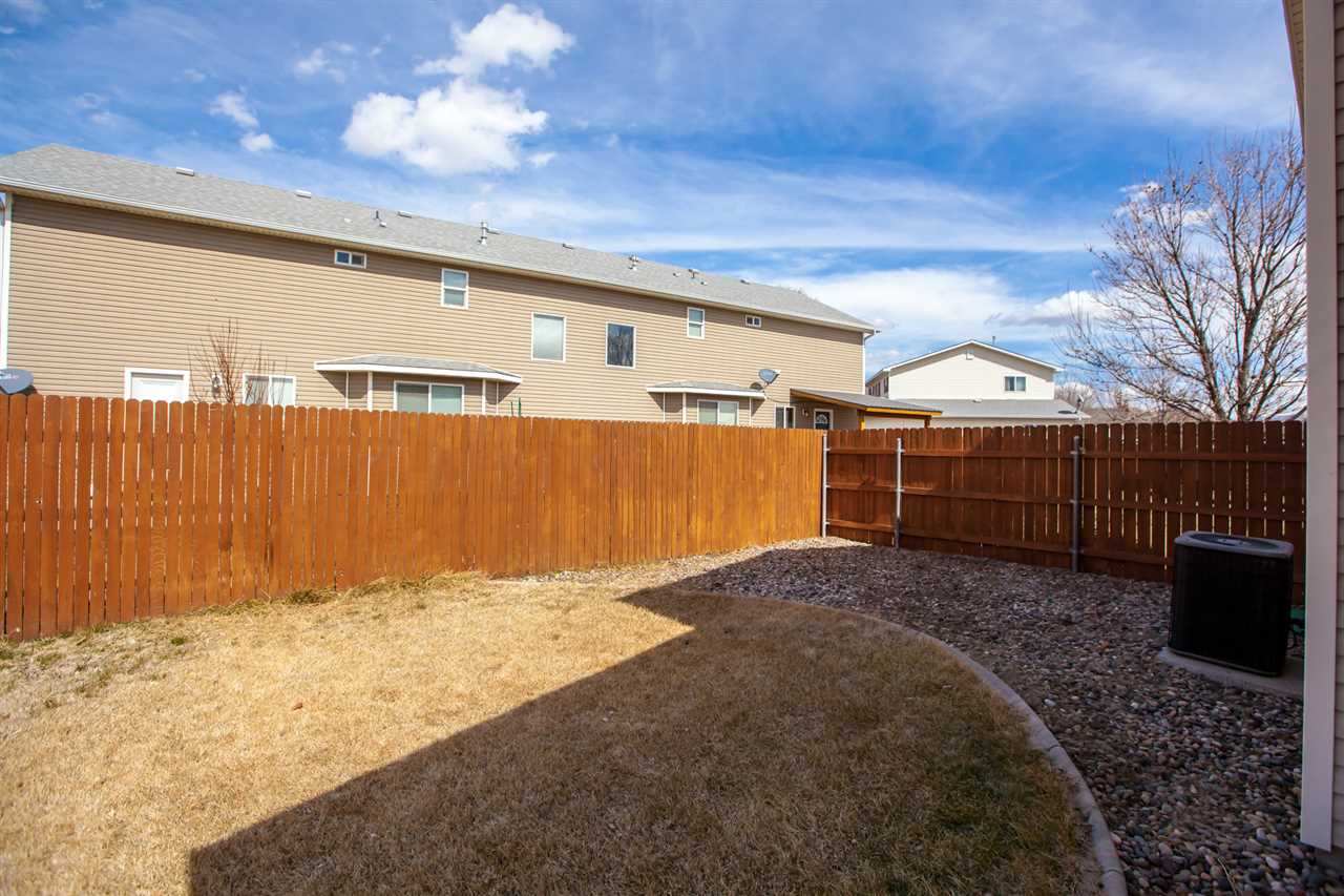 3138 Dublin Way Grand Junction, CO 81504 - Photo 32 of 42 a view of backyard with wooden fence