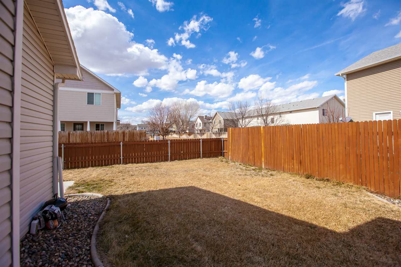 3138 Dublin Way Grand Junction, CO 81504 - Photo 33 of 42 a view of backyard with wooden fence