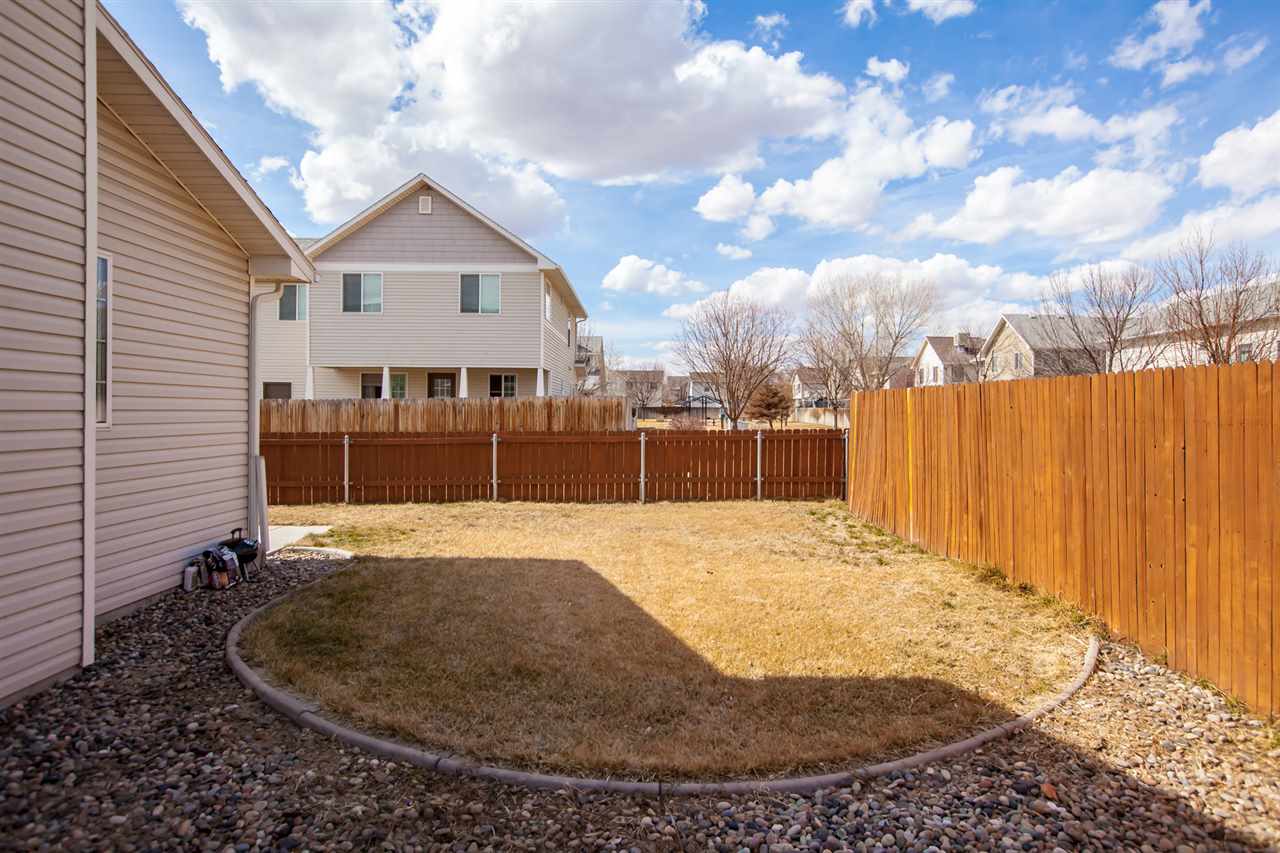 3138 Dublin Way Grand Junction, CO 81504 - Photo 34 of 42 a view of a house with a backyard