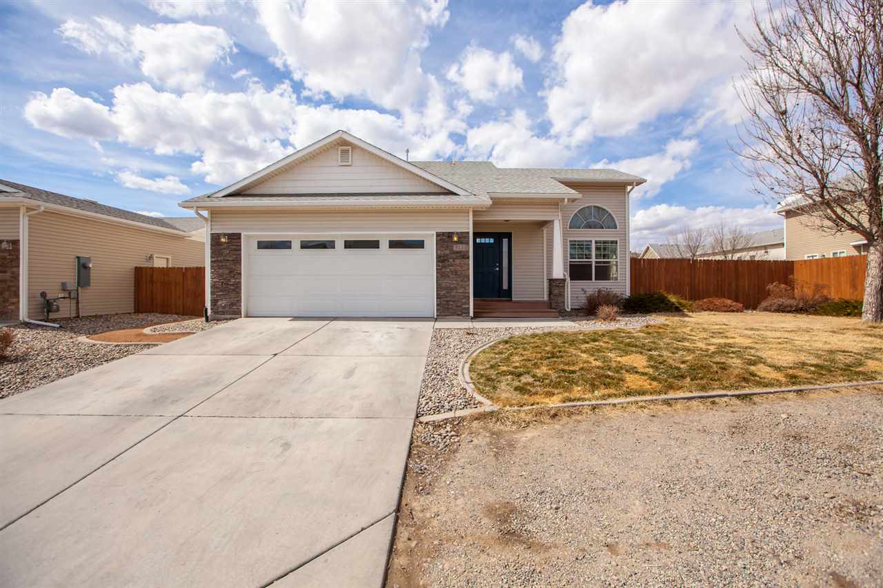 3138 Dublin Way Grand Junction, CO 81504 - Photo 41 of 42 a view of yellow house with a yard