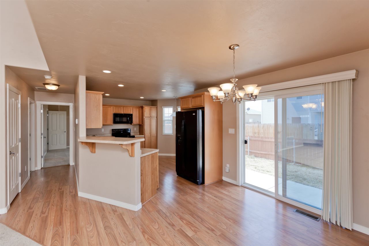 3138 Dublin Way Grand Junction, CO 81504 - Photo 6 of 42 a view of a kitchen and a refrigerator