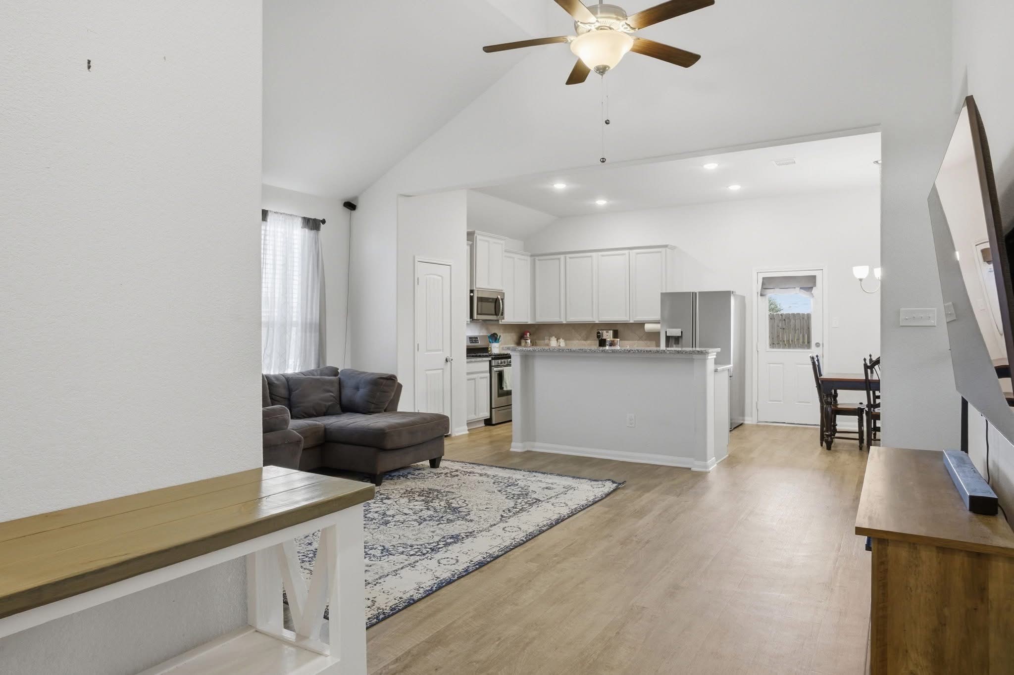 1495 Alice Drive Beaumont, TX 77705 - Photo 3 of 8 a living room with furniture and kitchen view