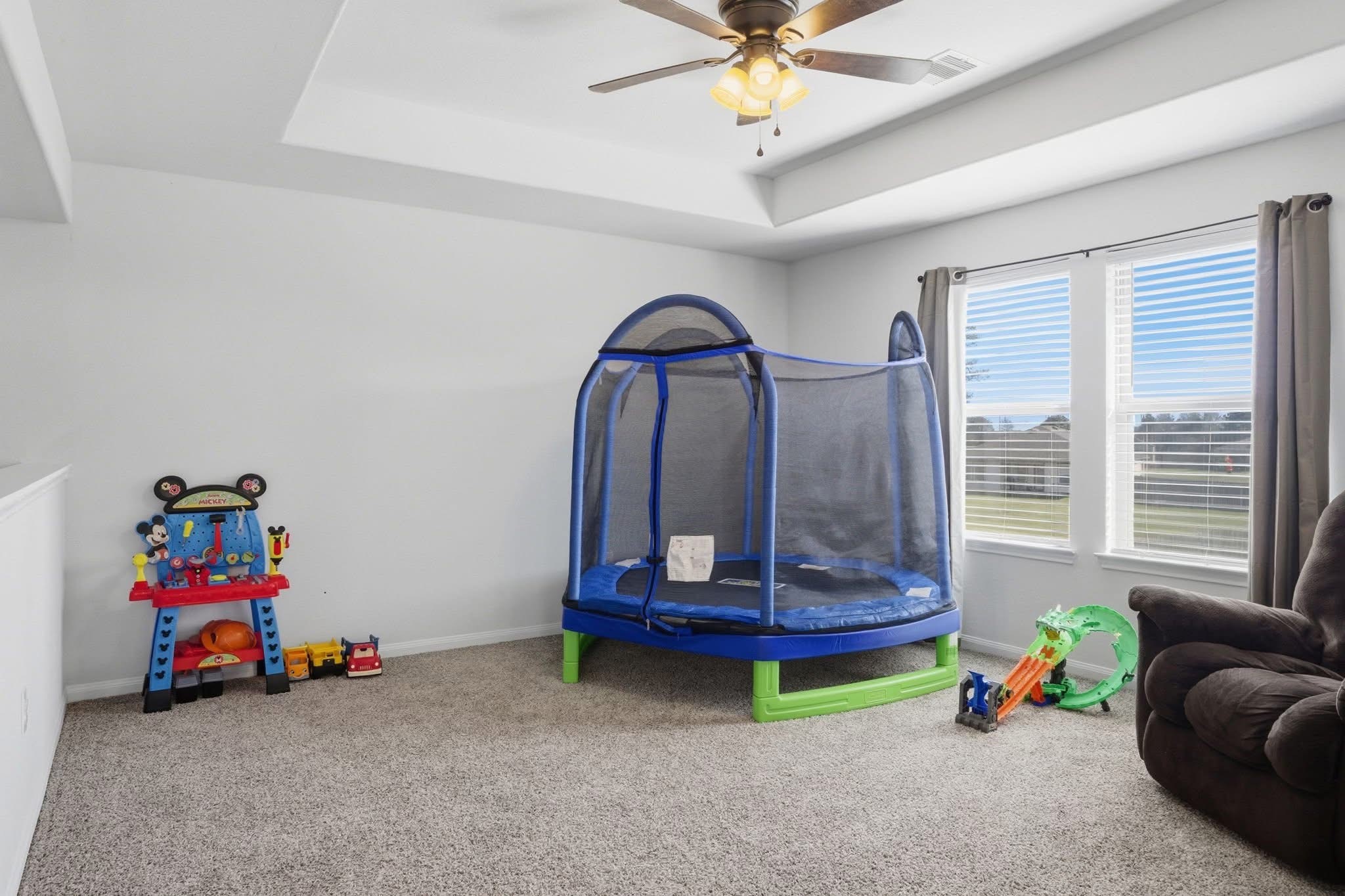 1495 Alice Drive Beaumont, TX 77705 - Photo 5 of 8 a living room with a baby crib furniture and a chandelier
