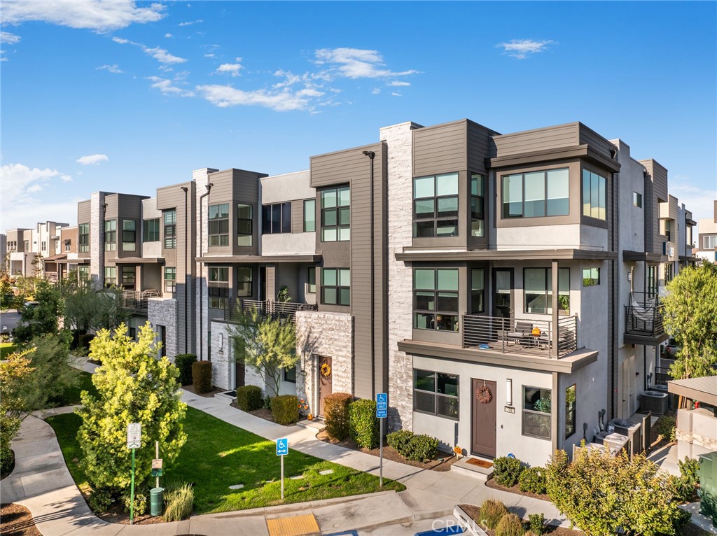 11055 Wander Drive Rancho Cucamonga, CA 91730 - Photo 1 of 28 a front view of a multi story residential apartment building with a yard