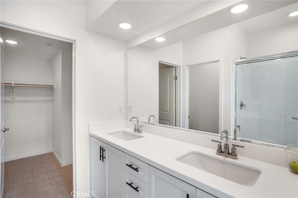 11055 Wander Drive Rancho Cucamonga, CA 91730 - Photo 14 of 28 a bathroom with a sink and a mirror