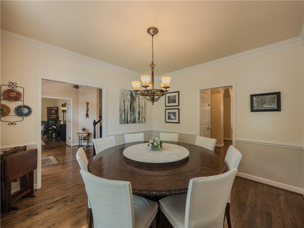4284 Cedar Bluff Way Southwest Lilburn, GA 30047 - Photo 33 of 62 a dining room with furniture and wooden floor
