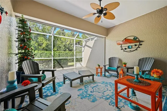 a living room with furniture a rug and a window