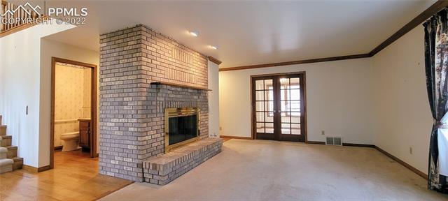 731 Winding Hills Road Monument, CO 80132 - Photo 5 of 9 Den and office on main floor with gas fireplace