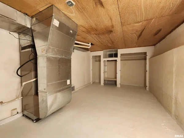 a utility room with cabinets washer and dryer