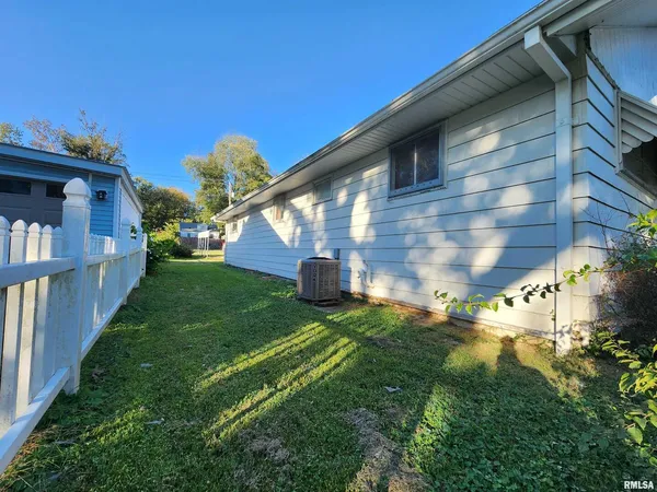 a view of a house with backyard porch and sitting area