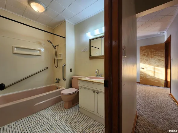 a bathroom with a toilet a sink and shower