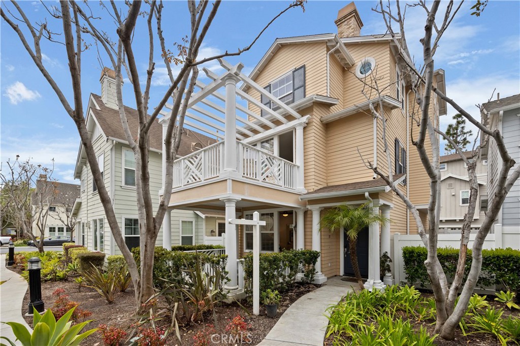 a view of a brick building next to a large tree