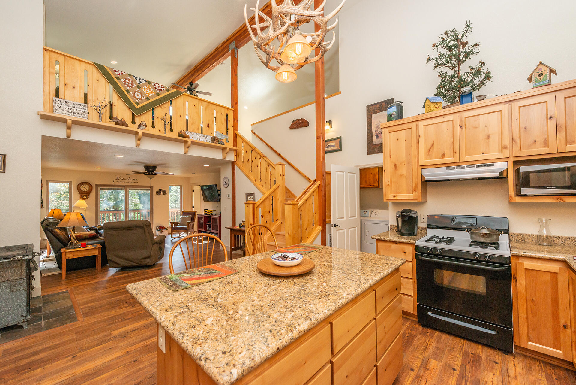 851 Mountain Aire Road Trinity Center, CA 96091 - Photo 24 of 54 a kitchen with stainless steel appliances granite countertop a stove a sink and cabinets