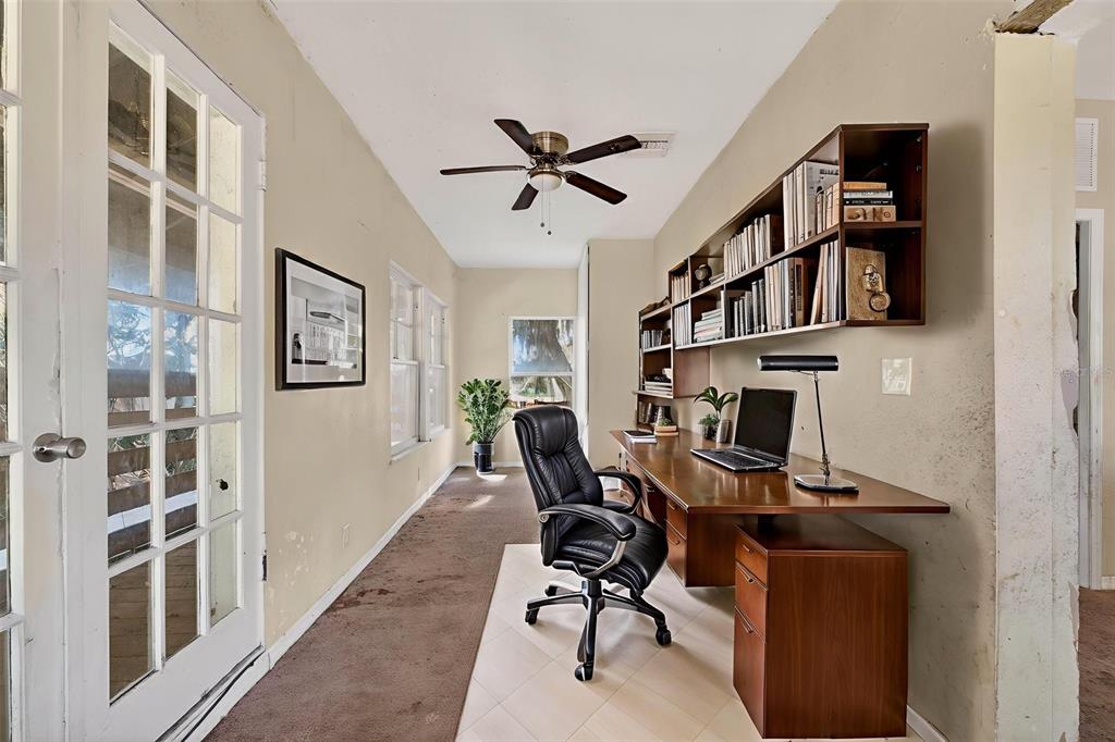 842 Channing Road Lakeland, FL 33805 - Photo 16 of 27 a view of a workspace with furniture and a window