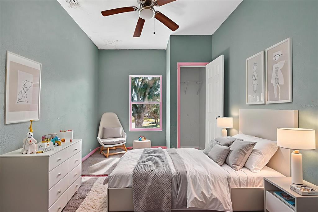 842 Channing Road Lakeland, FL 33805 - Photo 18 of 27 a bedroom with a bed dresser and a window