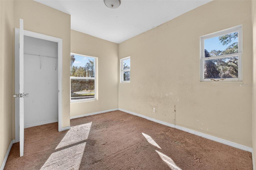 842 Channing Road Lakeland, FL 33805 - Photo 19 of 27 an empty room with windows