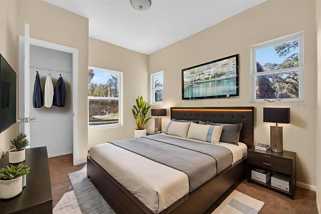 842 Channing Road Lakeland, FL 33805 - Photo 20 of 27 a bedroom with a bed and wooden floor