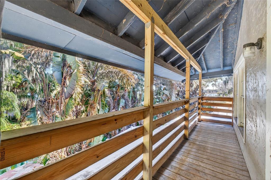 842 Channing Road Lakeland, FL 33805 - Photo 22 of 27 a view of a balcony with wooden floor and stairs